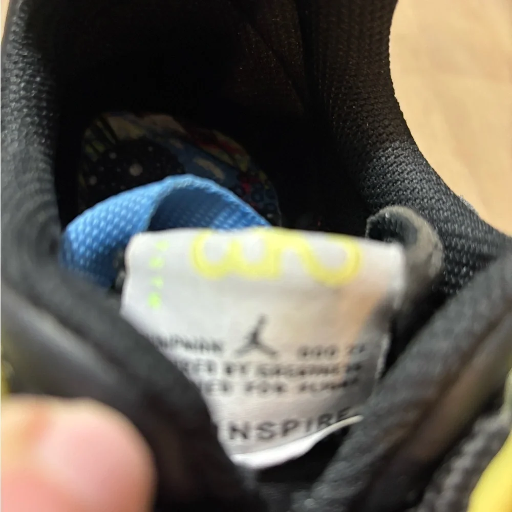 Nike Air Jordan’ size 6 Youth white, black, blue, yellow, pink.